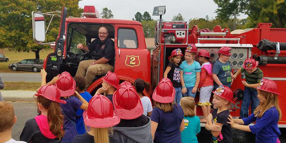 Shaun Evans, our past fire chief, with school children